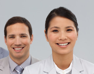 Close-up of two international co-workers