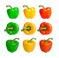 Red green and yellow peppers in different positions isolated