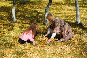Mother and daughter playing in the park.