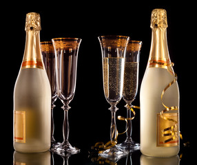 Glasses of champagne with bottle