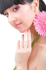 Young woman with gerber flower