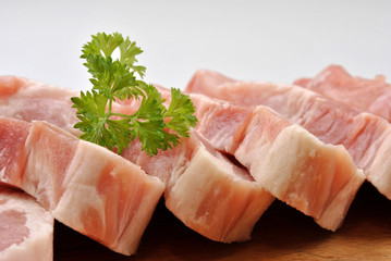 some raw organic pork chop and parsley