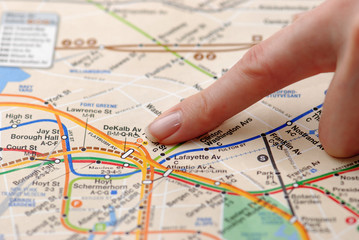 A finger showing on a map