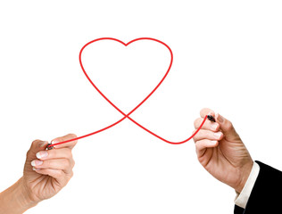 Man and woman drawing heart