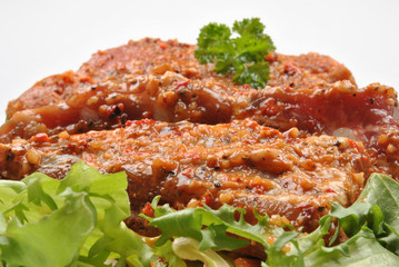 some marinated organic rib on healthy salad