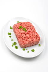 minced meat with parsley on a plate