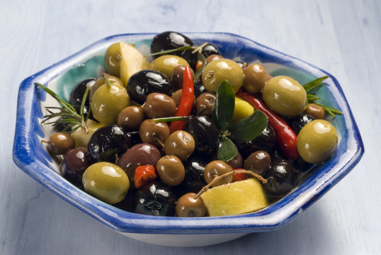 Spanish tapas. Olives in a blue plate.