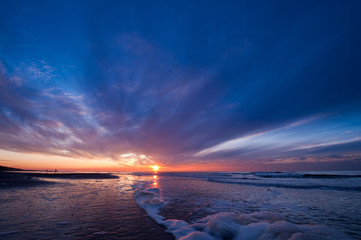 Obraz premium Sunset on the beach in the Netherlands