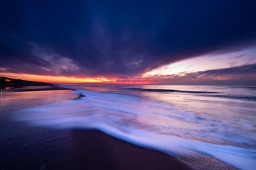 Fototapeta na wymiar Sunset on the beach in the Netherlands