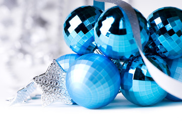 Blue Christmas baubles with silver decoration, isolated