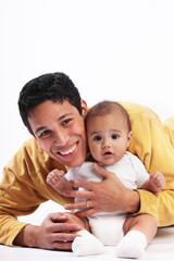 Obraz na płótnie Canvas Happy father hugging baby son