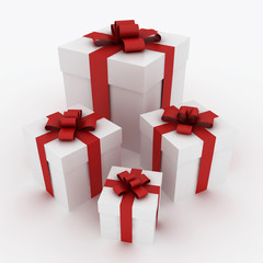 Beautiful white gift boxes with red ribbon isolated on white