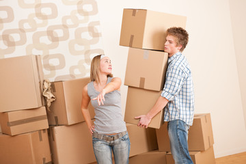 Moving house: Man and woman with box