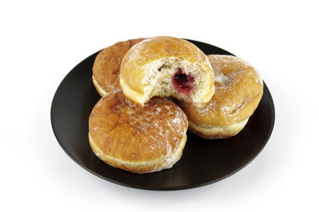 Plate of Doughnuts with Bite Mark