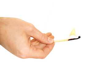 Hand holding a burning match