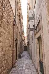 A narrow cobblestoned alley through the old town of Dubrovnik