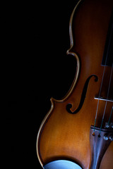 beautiful vintage violin over dark background