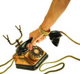 Female hand  dialling an old style telephone