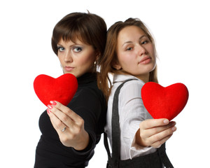 Girl with red heart in hands