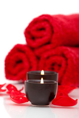 Fototapeta na wymiar Spa candles, towels, rose petals