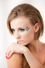 Naklejka premium Portrait of a girl with colorful eyes
