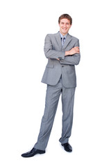 Enthusiastic businessman standing with folded arms