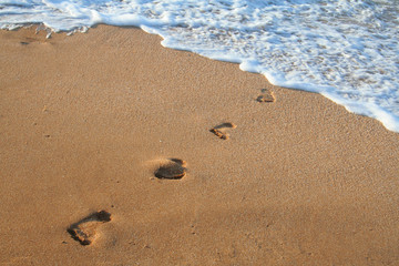 Footprints on the sea's sand