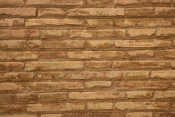 Brown brick wall in cream beige color background