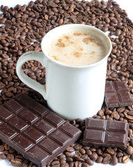 cup of cappuccino coffee and chocolate