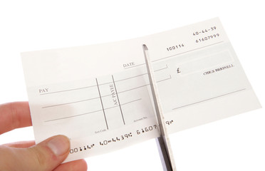 Cheque being cut up cutout