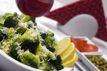 Served hot broccolli dish with parmesan cheese