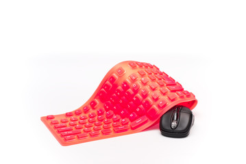magenta flexible keyboard with black mouse isolated