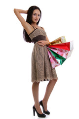 Shopping woman smiling. Isolated over white background