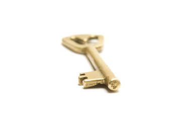 One golden and old key isolated on white background