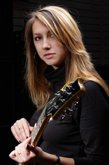 young female with rock guitar