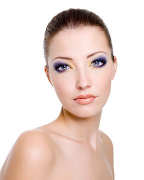Beautiful  female face with fashion makeup on a white