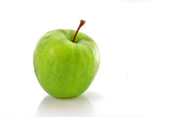 wet green apple covered with  water drops on white background.