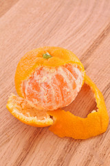 Fresh mandarin isolated on wooden background