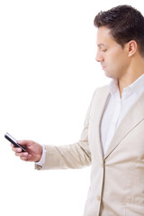 Young business man using cellphone isolated on white background