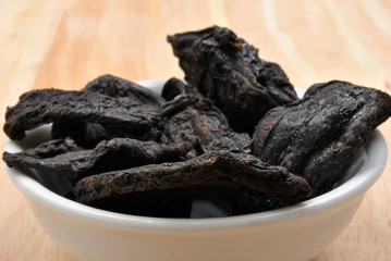 organic black tamarind on a timber board