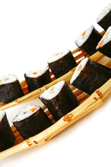 sushi on small bamboo boat