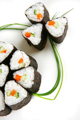 served shushi rolls on white
