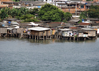 poor houses built out over the water in brazil