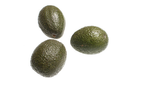Fresh avocados isolated on white.
