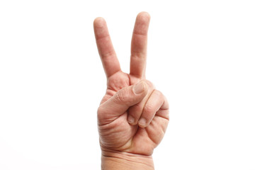 A hand gesture associated with "victory" or "peace."