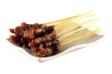 A plate of chicken satay isolated in a white background