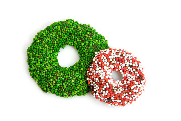 Green and colored speckled christmas candy wreath over white