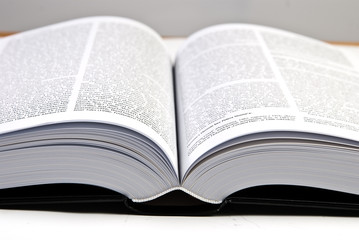 opened big hefty book on the table