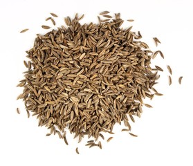Seeds of caraway on white background