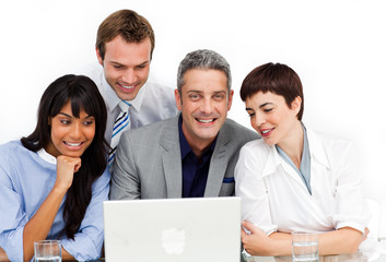 Fototapeta premium A diverse business group using a laptop